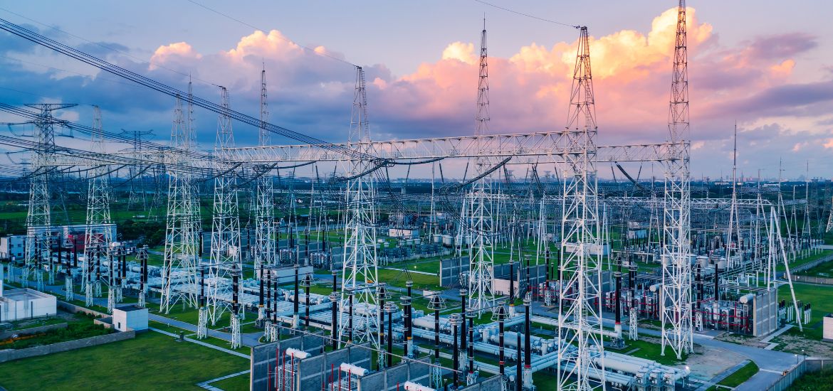 High-voltage substation at sunset