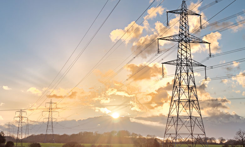 Electricity transmission pylons at golden hour